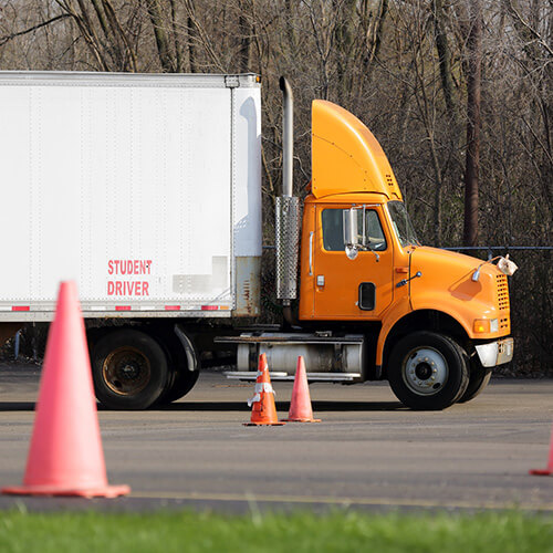 Student truck driver practices parking maneuvers